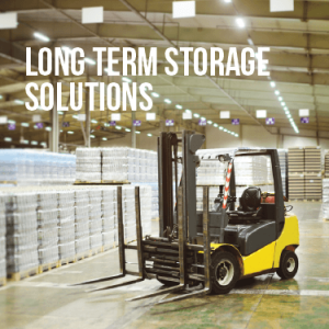 an empty forklift sits in a warehouse with other supplies