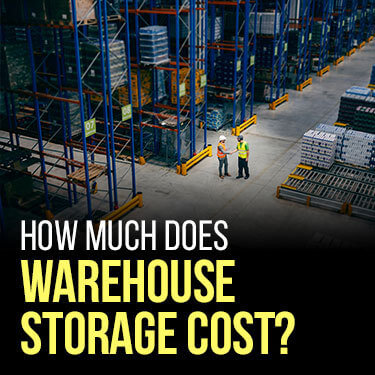 Two workers discussing the types of warehouse storage systems