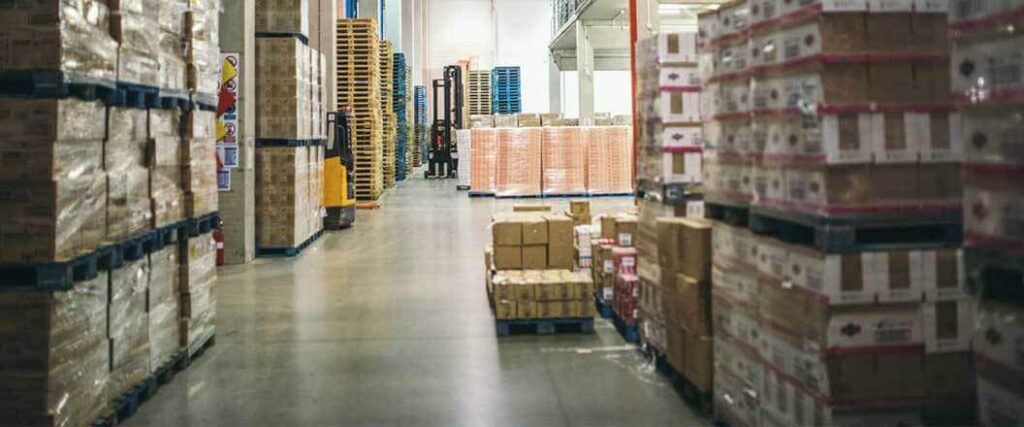 Palletized and shelved items in a warehouse.